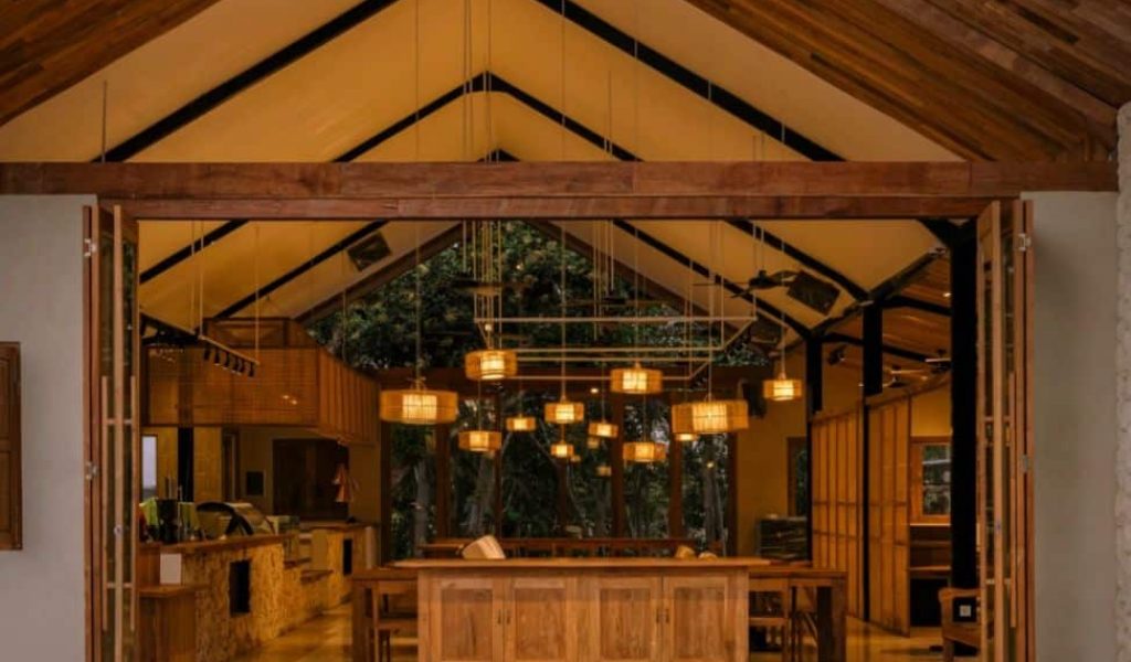 Cozy indoor dining space at Tanah Uluwatu with modern design and warm ambiance.