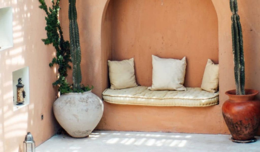 Gaia Villa pool surrounded by greenery and rustic decor