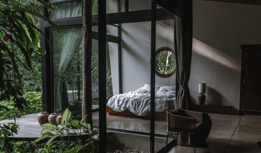 Brutalist interior at Zen River House in Ubud featuring raw concrete architecture, clean lines, and natural surroundings